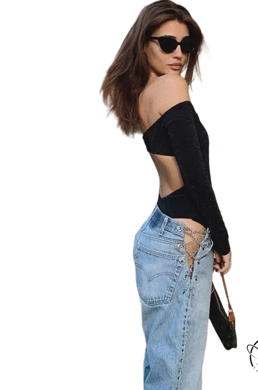 Woman in off-shoulder black top and sexy chain straight jeans