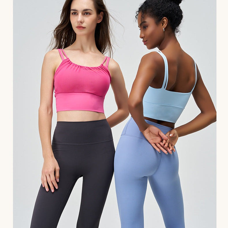 Two women in CUTE PLEATED MESH YOGA VESTs in Glacier Blue and Cherry Blossom Powder