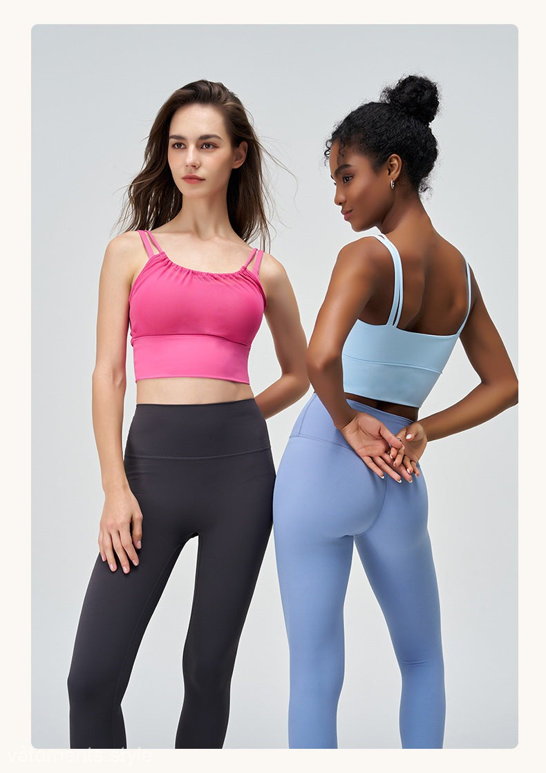 Two women in CUTE PLEATED MESH YOGA VESTs in Glacier Blue and Cherry Blossom Powder