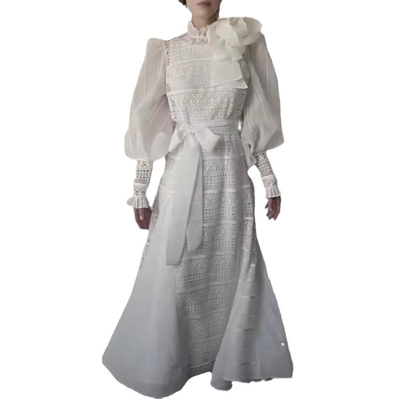 Elegant white lace gown with lantern sleeves showcasing floral stitching design for women