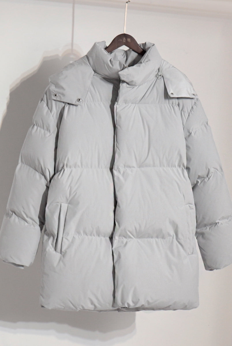 Gray puffer coat on hanger showcasing stylish langry fashion ملابس for winter wear