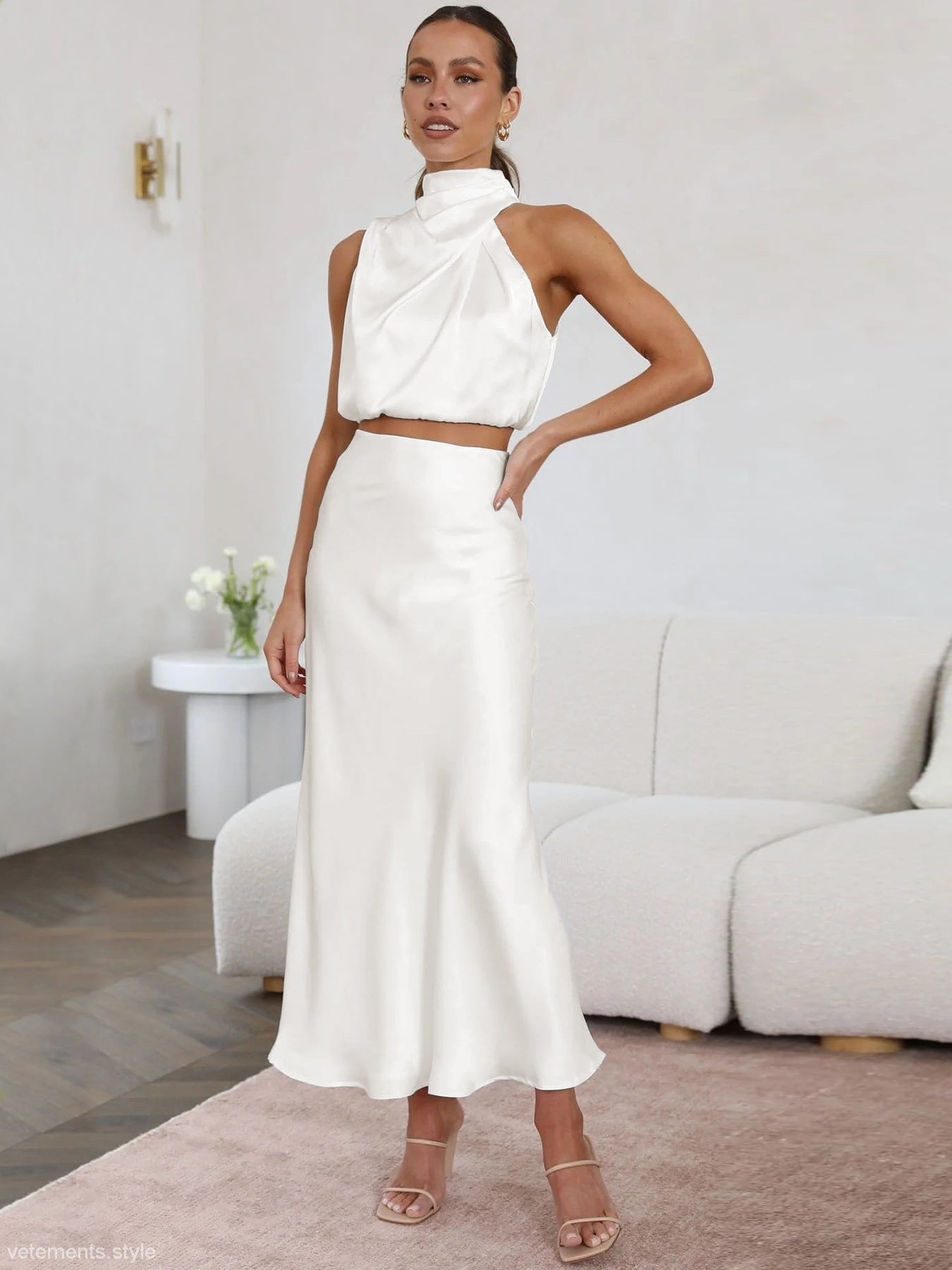Woman modeling the ENCHANTING DRAPING SKIRT SET in a sexy white satin draping skirt
