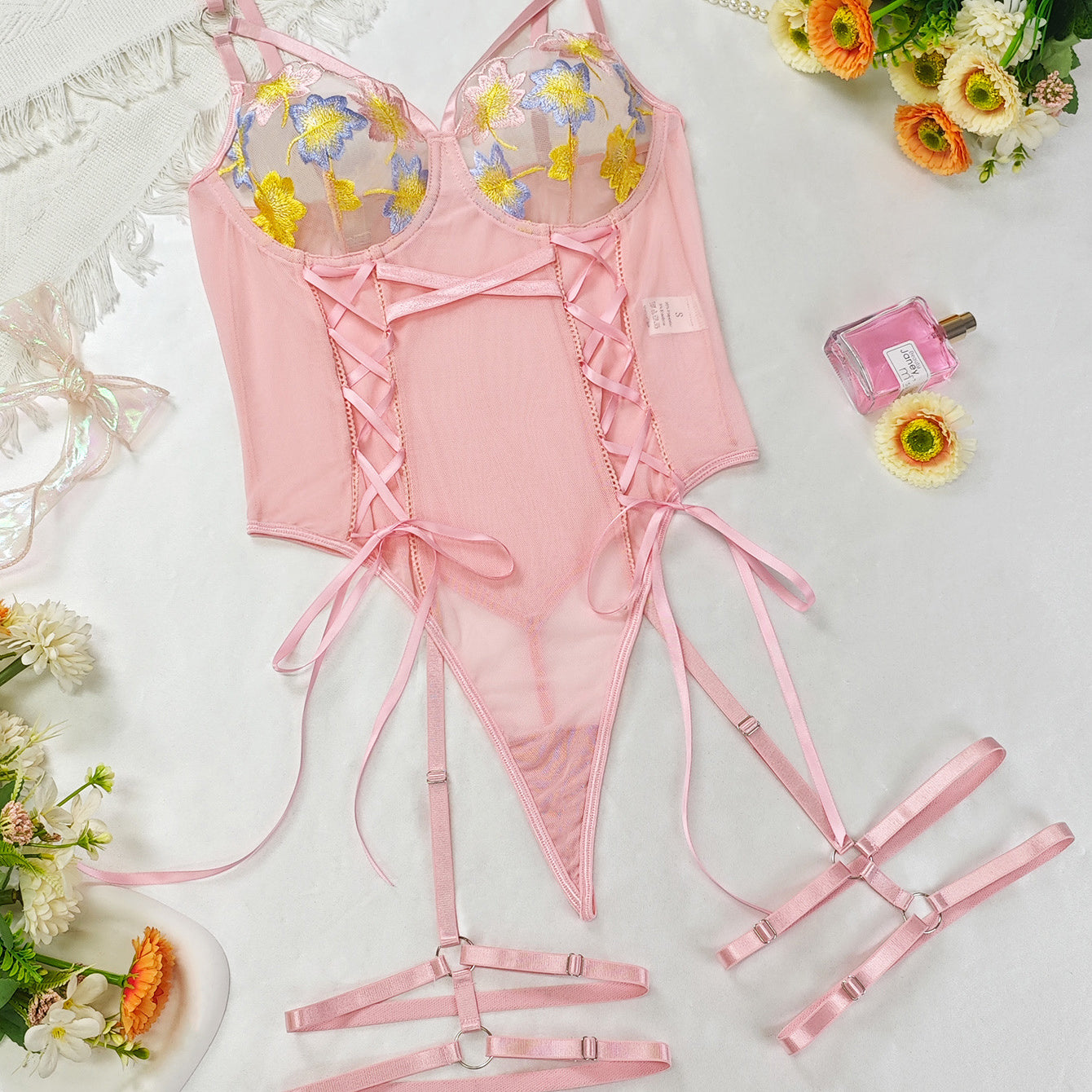 Pink embroidery lingerie set with floral lace accents and adjustable straps for fashion