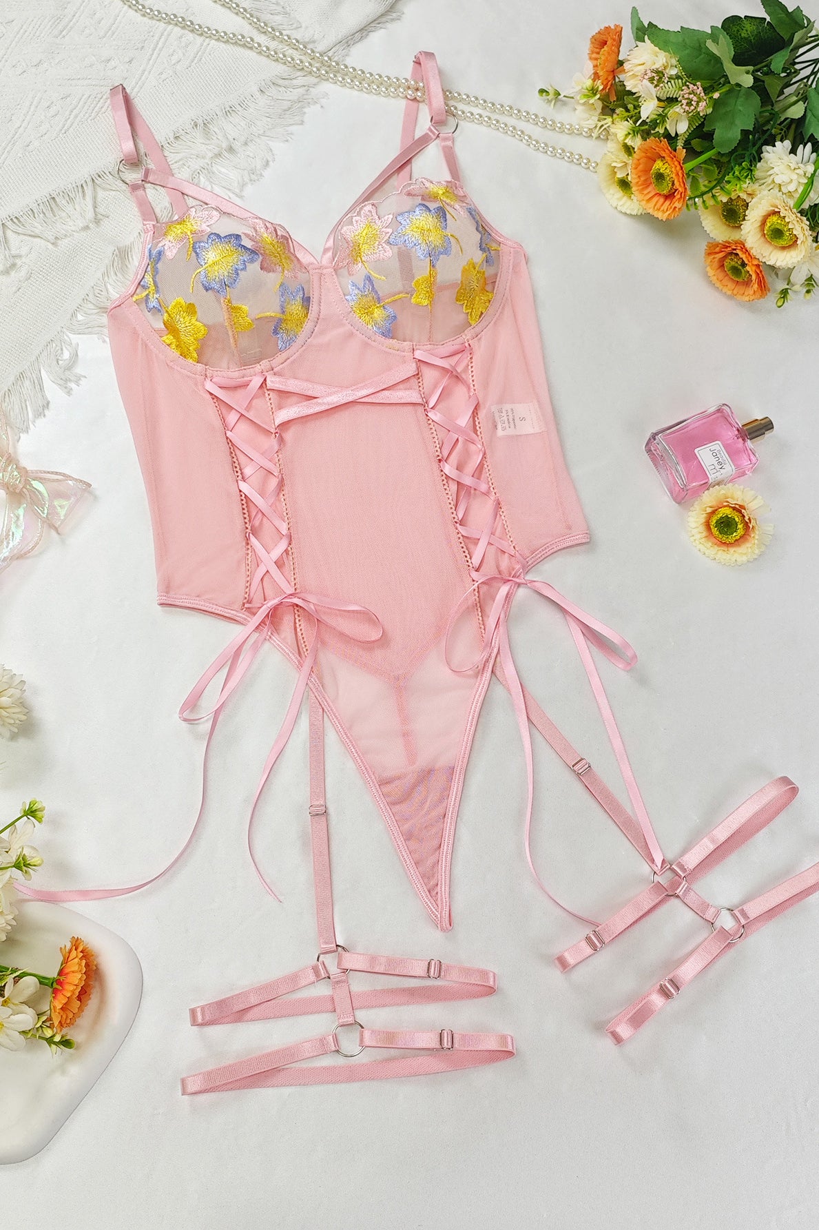 Pink embroidery lingerie set with floral lace accents and adjustable straps for fashion
