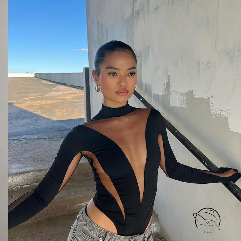 Black long-sleeved bodysuit with sheer mesh stitching panels