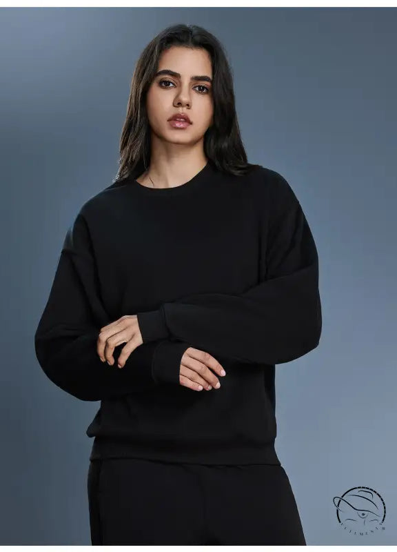 Black long sleeve oversized cotton blend hoodie with ribbed cuffs