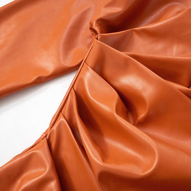Orange faux leather garment from Elegant Leather Short Dress, perfect for fashion enthusiasts