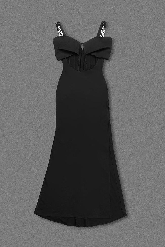 Elegant black maxi dress with spaghetti straps and bow detail, perfect for evening fashion