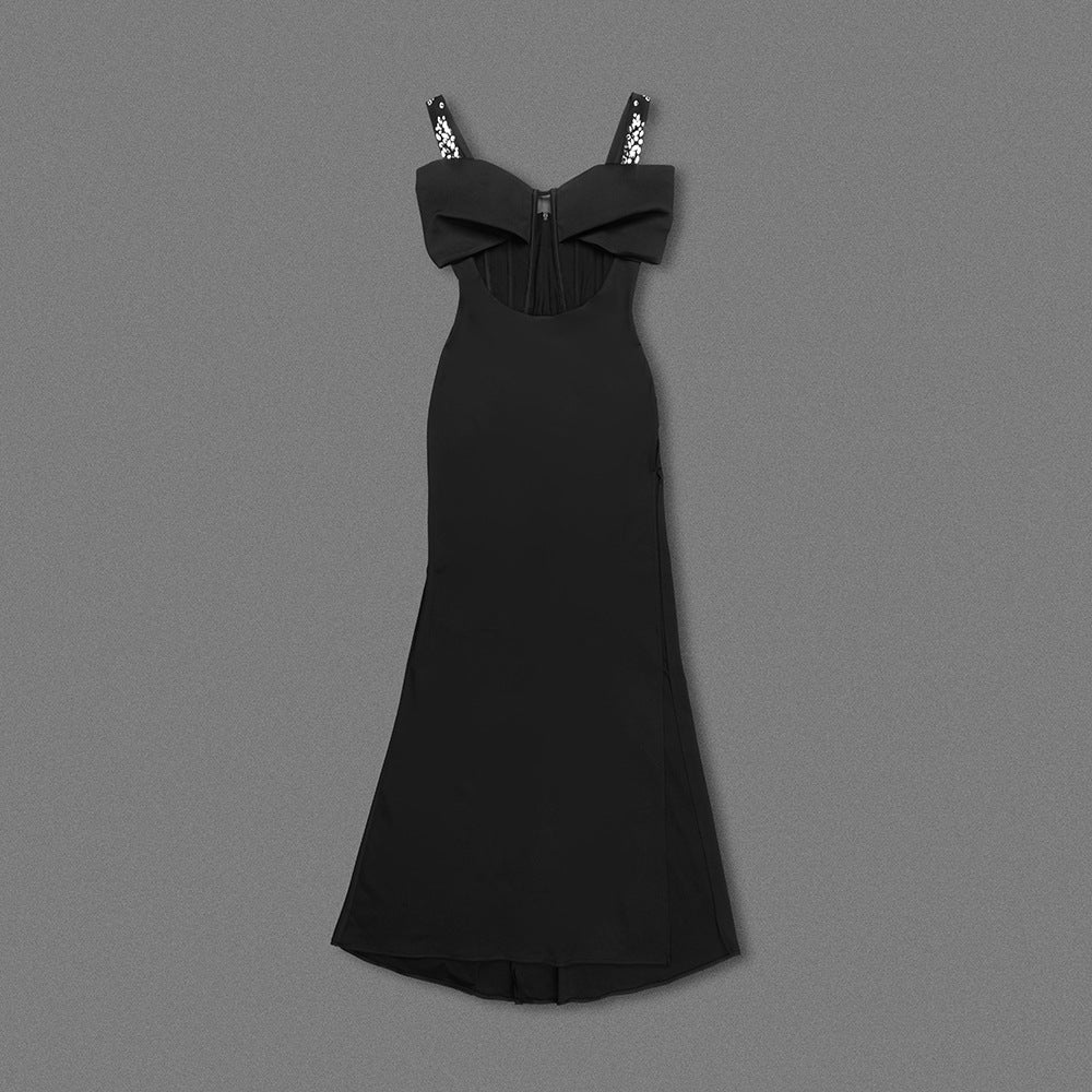 Elegant black maxi dress with spaghetti straps and bow detail, perfect for evening fashion