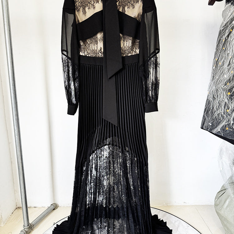 Elegant black lace and pleated long dress showcasing luxury fashion and ملابس elegance