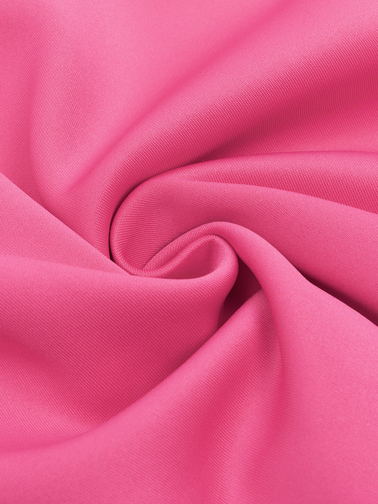 Fuchsia pink jersey knit fabric with soft folds for an elegant shoulder ruffled cocktail dress