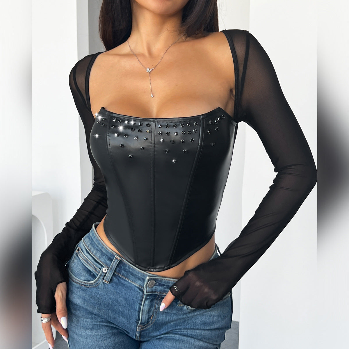 Black faux leather studded corset top from Langry Fashion, perfect for chic style