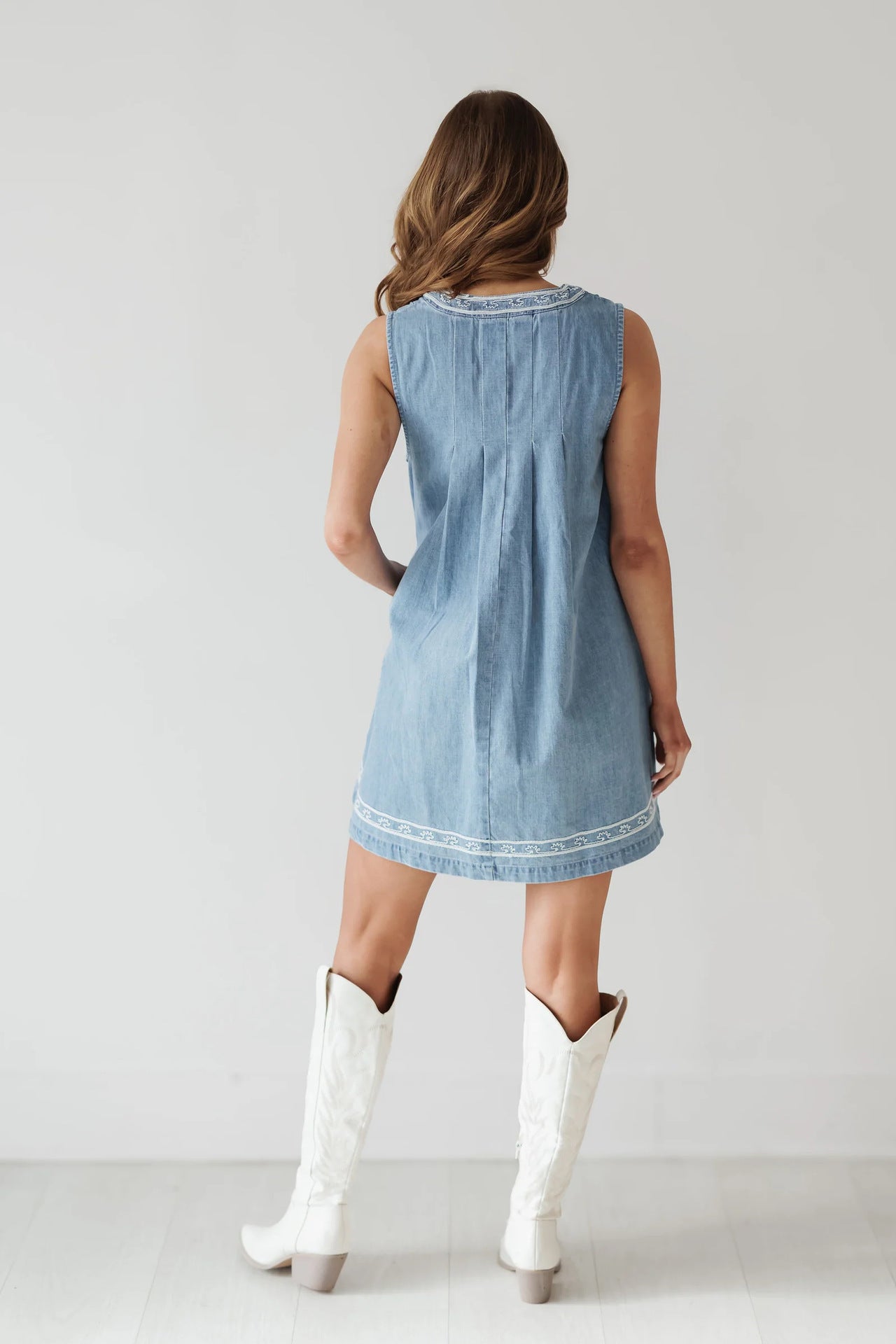 Sleeveless denim dress with white trim in Beautiful Embroidered Vest Denim Dress fashion