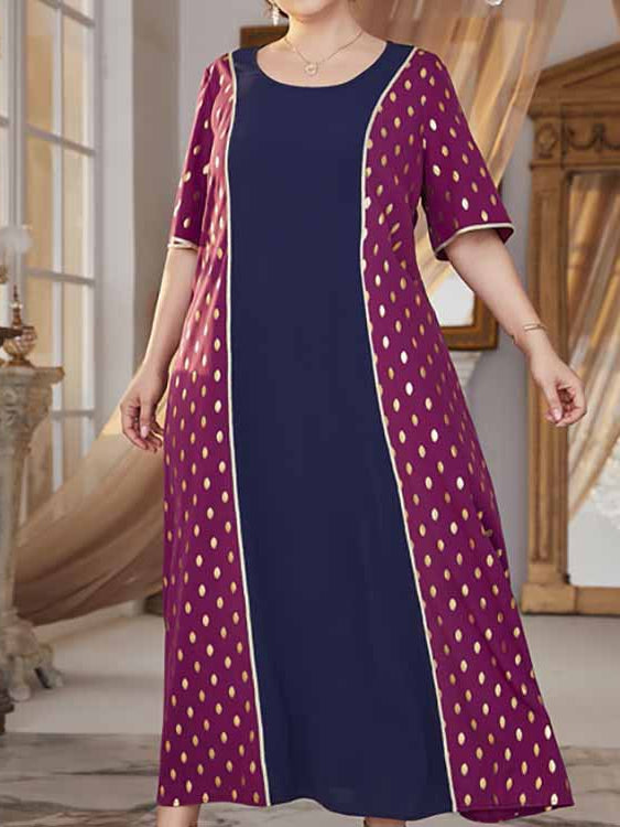 Plus-size maxi dress with navy blue center and magenta polka dot side panels featuring a comfy high waist elastic waist design