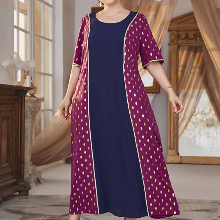 Plus-size maxi dress with navy blue center and magenta polka dot side panels featuring a comfy high waist elastic waist design