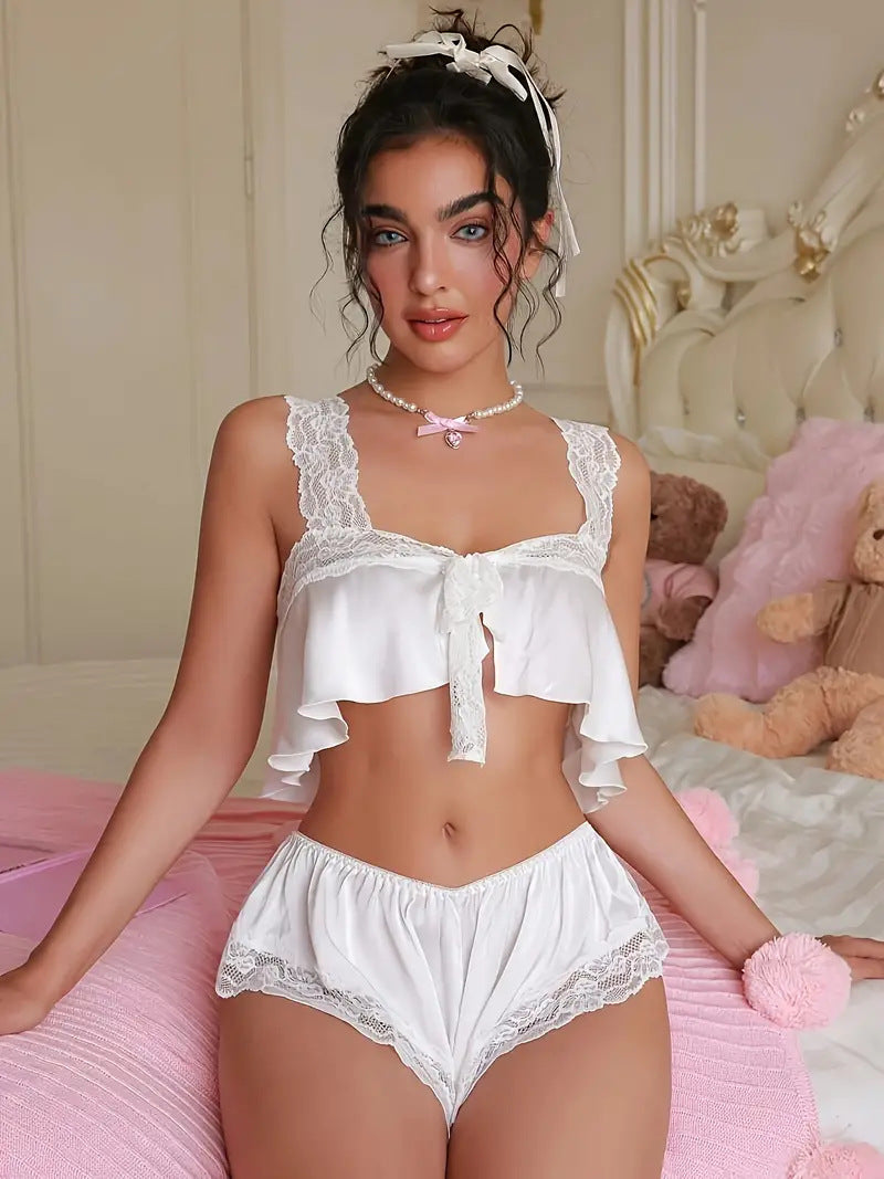 White lace-trimmed lingerie set with ruffled crop top and shorts for elegant fashion