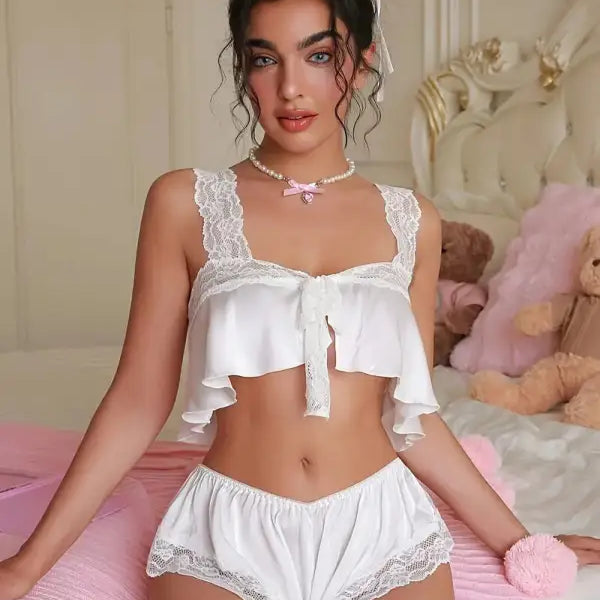 Seductive lingerie set in white lace with ruffled crop top and shorts