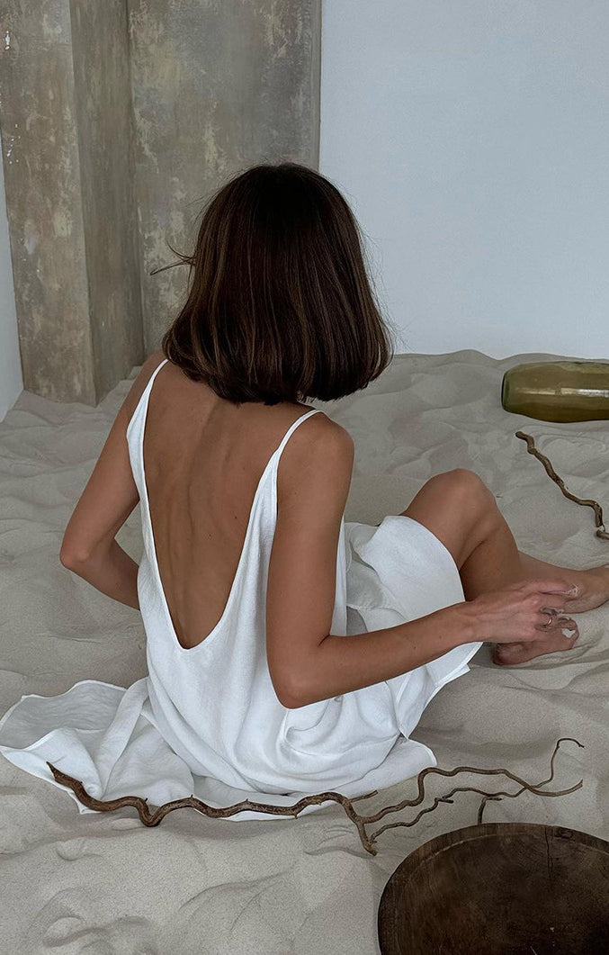 White langry fashion open-back dress with ruffled hem, spaghetti straps, ideal pajamas