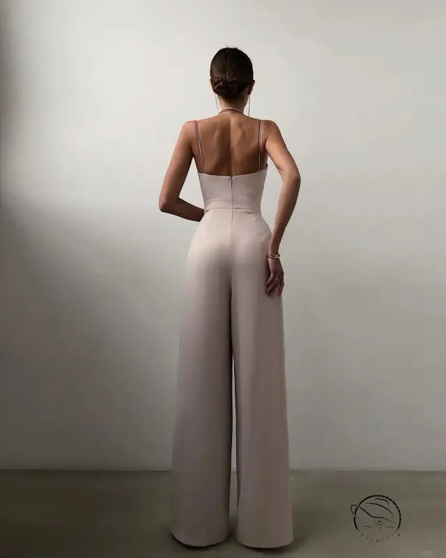 Elegant white modern jumpsuit with fitted bodice and open back