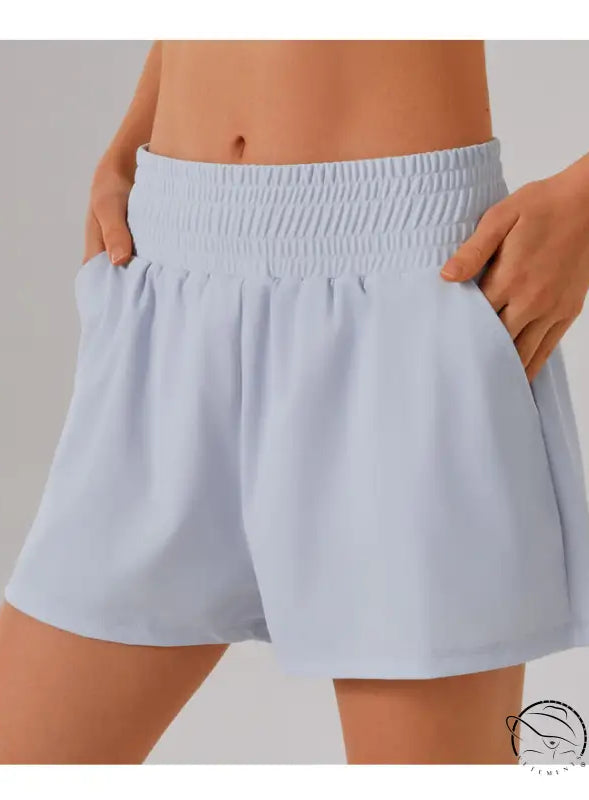 Light blue elastic-waist shorts with pockets in loose sports yoga fitness set