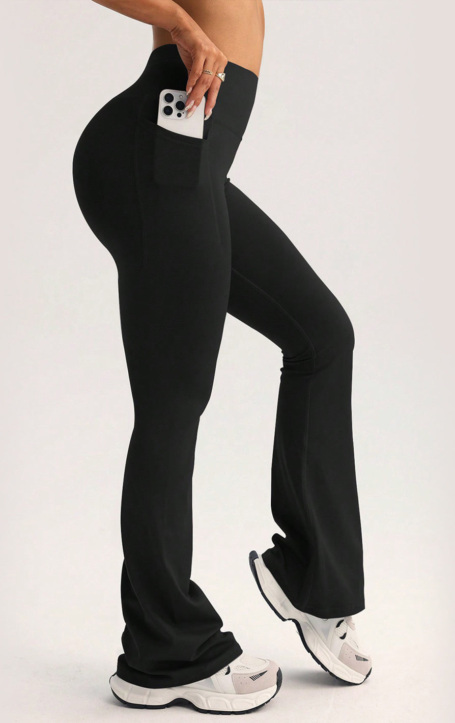 Black high-waisted flare yoga pants with side pocket in langry fashion ملابس