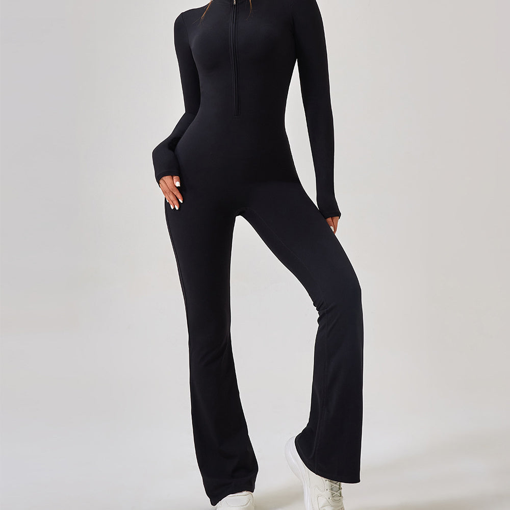 Black long-sleeved zip-up jumpsuit with flared legs and white sneakers in Comfy One Piece Sportswear