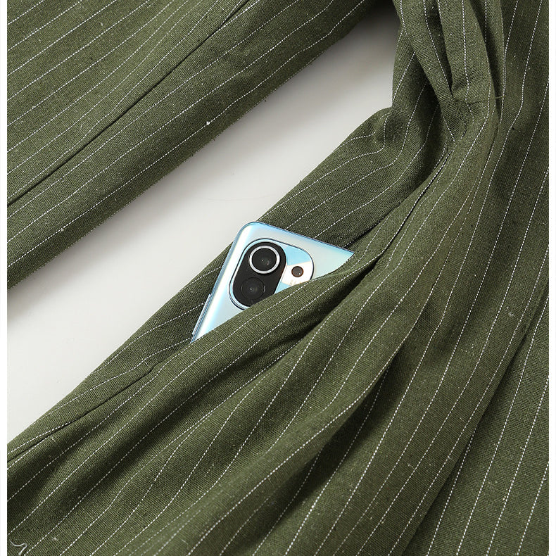 Green pinstripe Elegant Colorful Blazer with a phone in the pocket, showcasing fashion