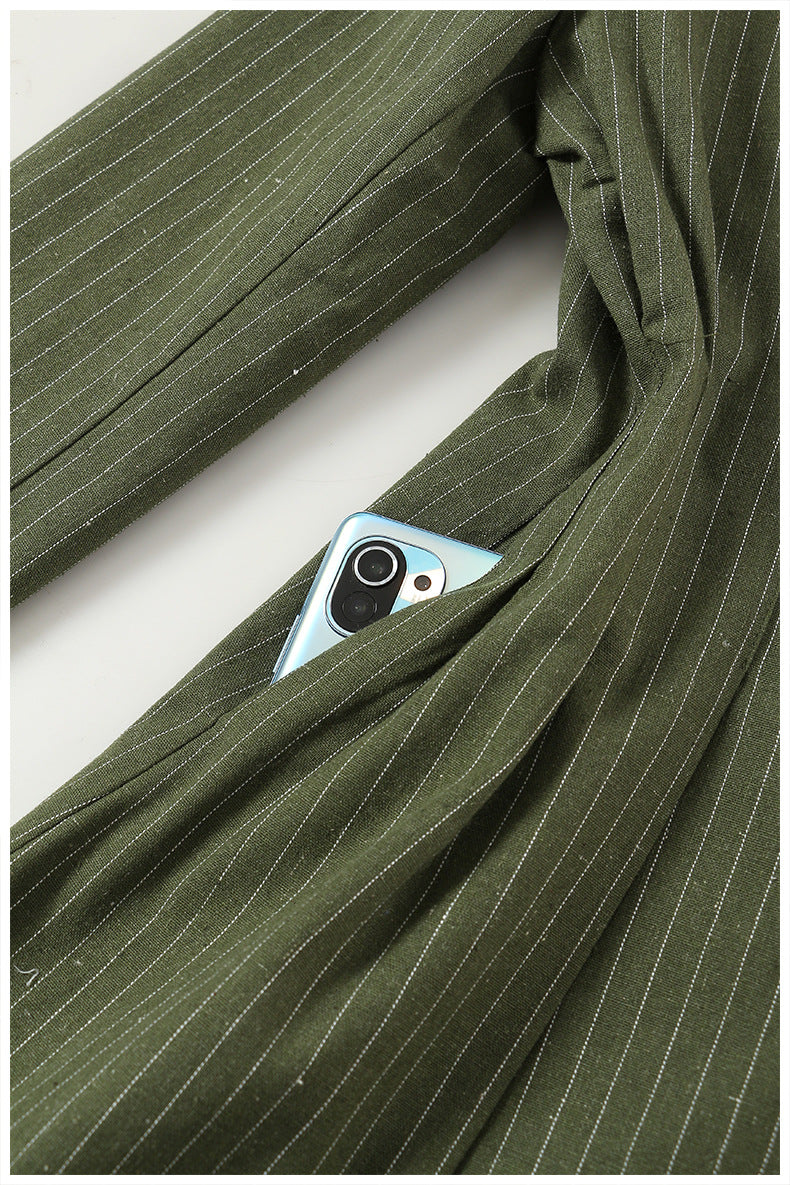 Green pinstripe Elegant Colorful Blazer with a phone in the pocket, showcasing fashion