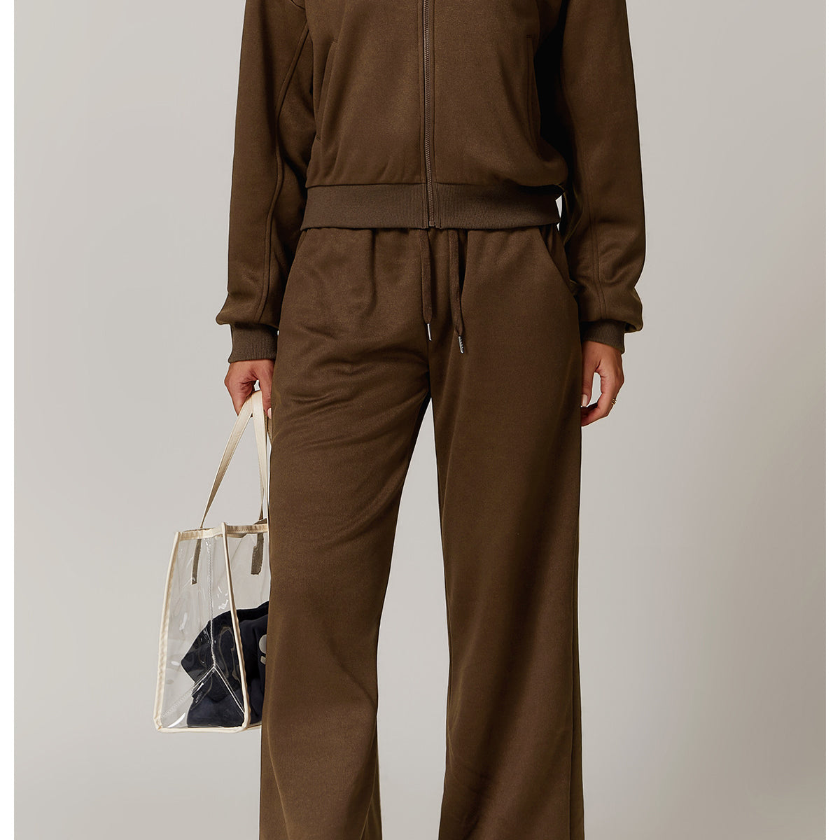 Brown tracksuit with a clear tote bag, perfect for outdoor warm sports fashion enthusiasts