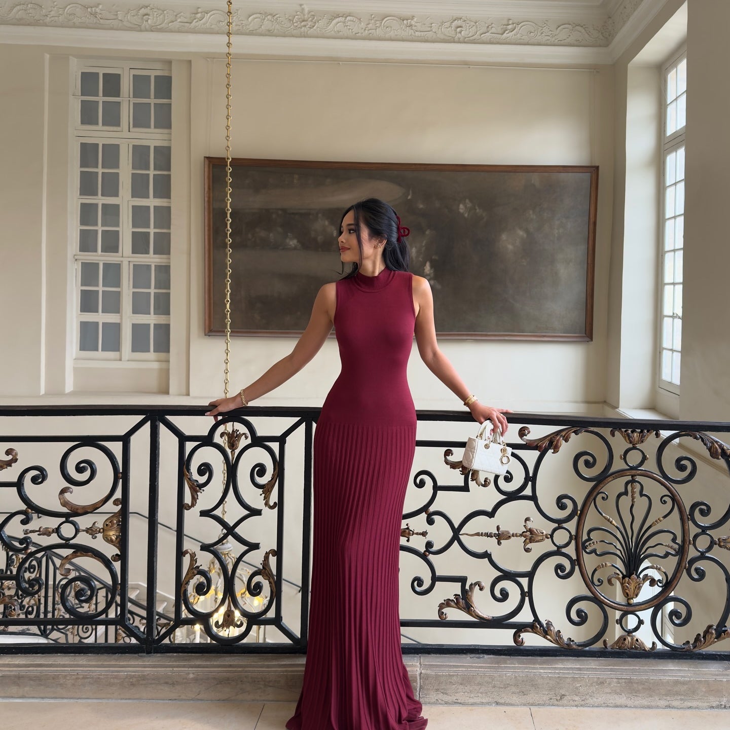 Sleeveless burgundy maxi dress with ribbed texture, perfect for elegant fashion occasions