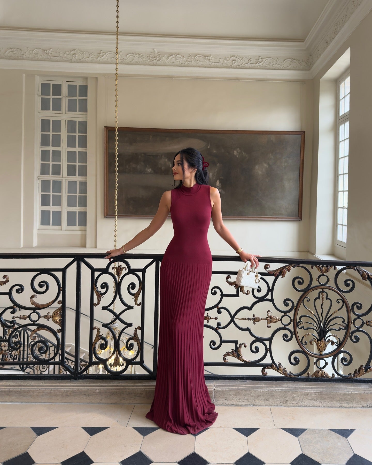 Sleeveless burgundy maxi dress with ribbed texture, perfect for elegant fashion occasions
