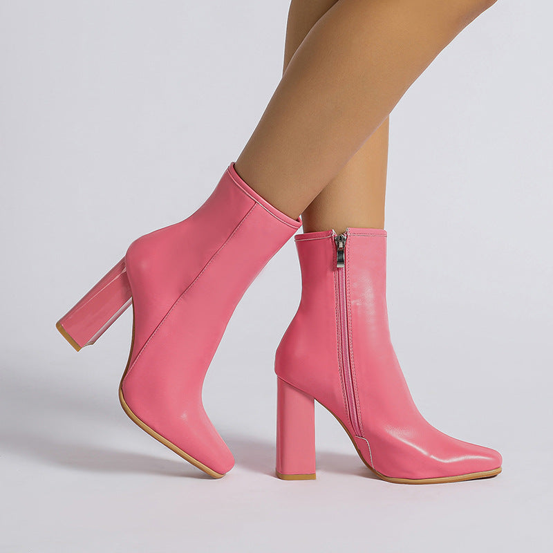 Pair of pink heeled ankle boots featured in Winter Fruit Pink Middle Boots for stylish fashion