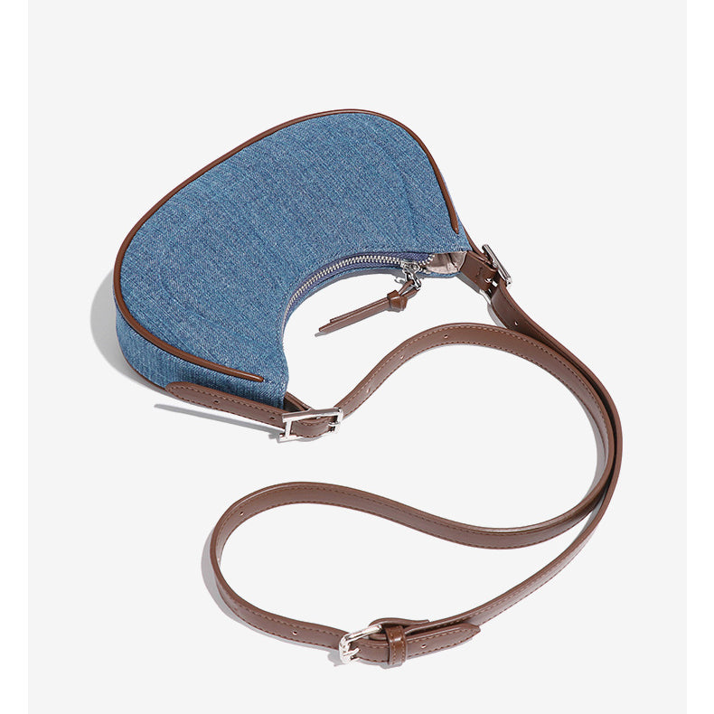 Denim Crescent Handbag with brown leather strap, stylish accessory for fashion and ملابس