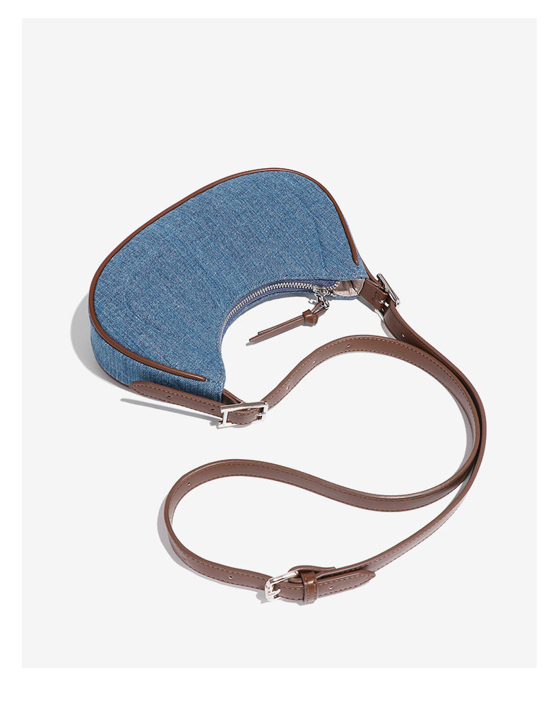Denim Crescent Handbag with brown leather strap, stylish accessory for fashion and ملابس