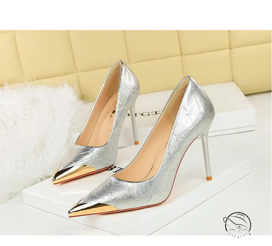 Silver metal pointed super high heel pumps with gold accents