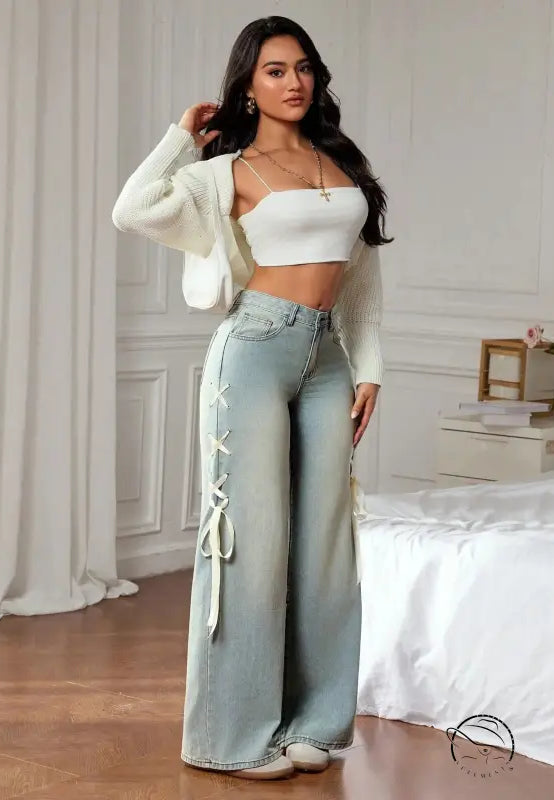 Light-wash wide leg denim pants with white lace-up side ties, casual fashion