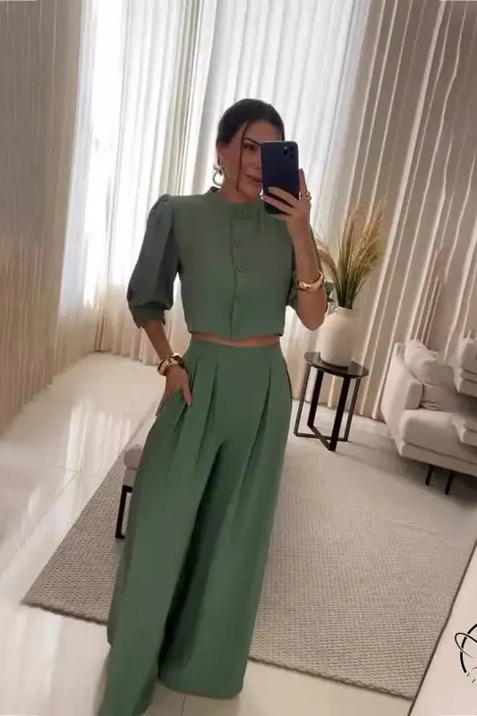 Woman in green summer striped half sleeve crop top and wide-leg pants