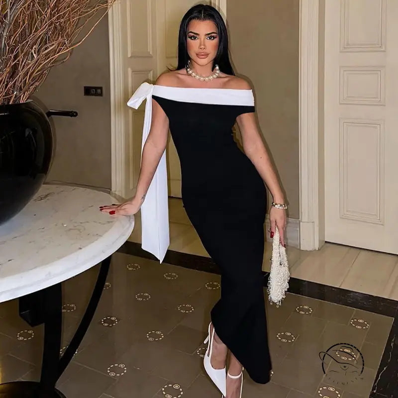 Elegant langry black and white off-shoulder fashion evening gown with dramatic side bow