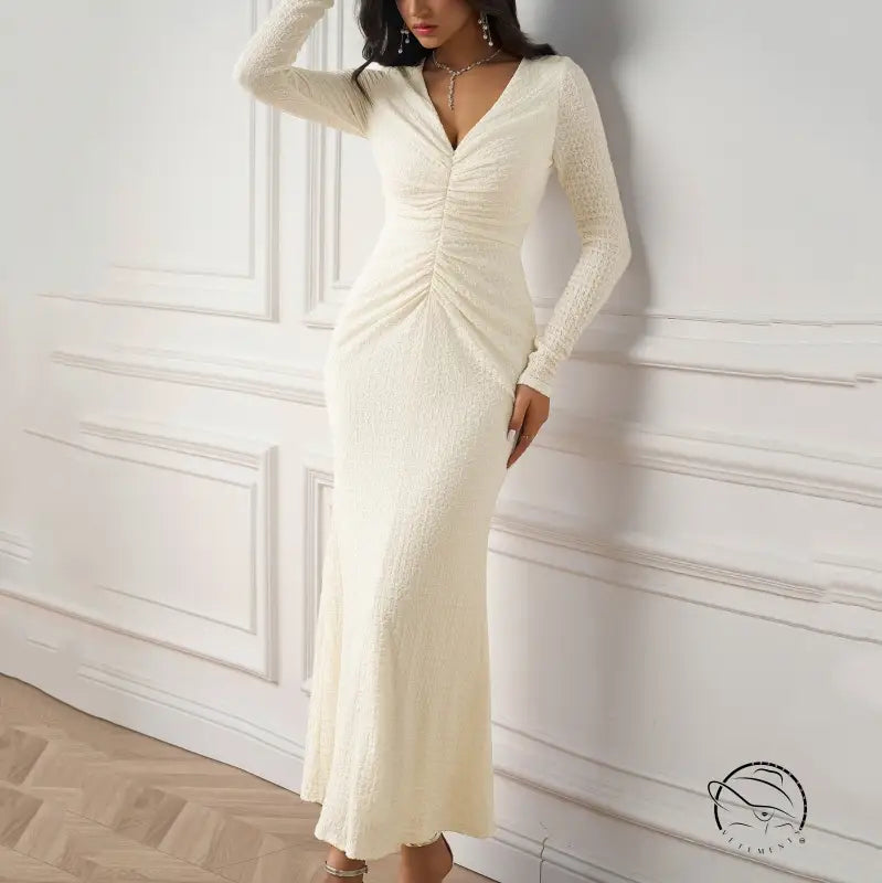 Beautiful knitted dress in cream-colored long-sleeved ruched style