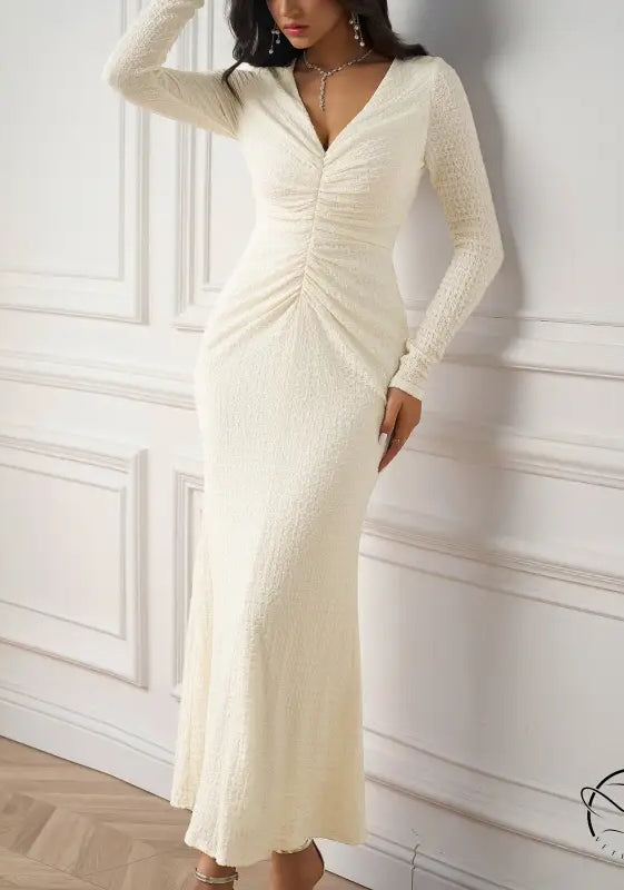 Beautiful knitted long-sleeved white dress
