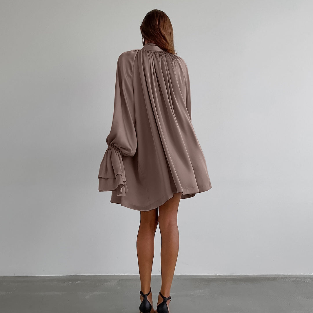 Flowy mauve satin dress featuring billowing long sleeves and gathered back design