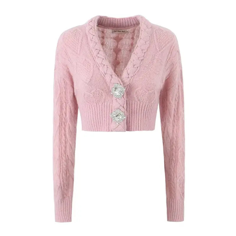 Pink cropped cardigan sweater coat with cable knit pattern and decorative buttons