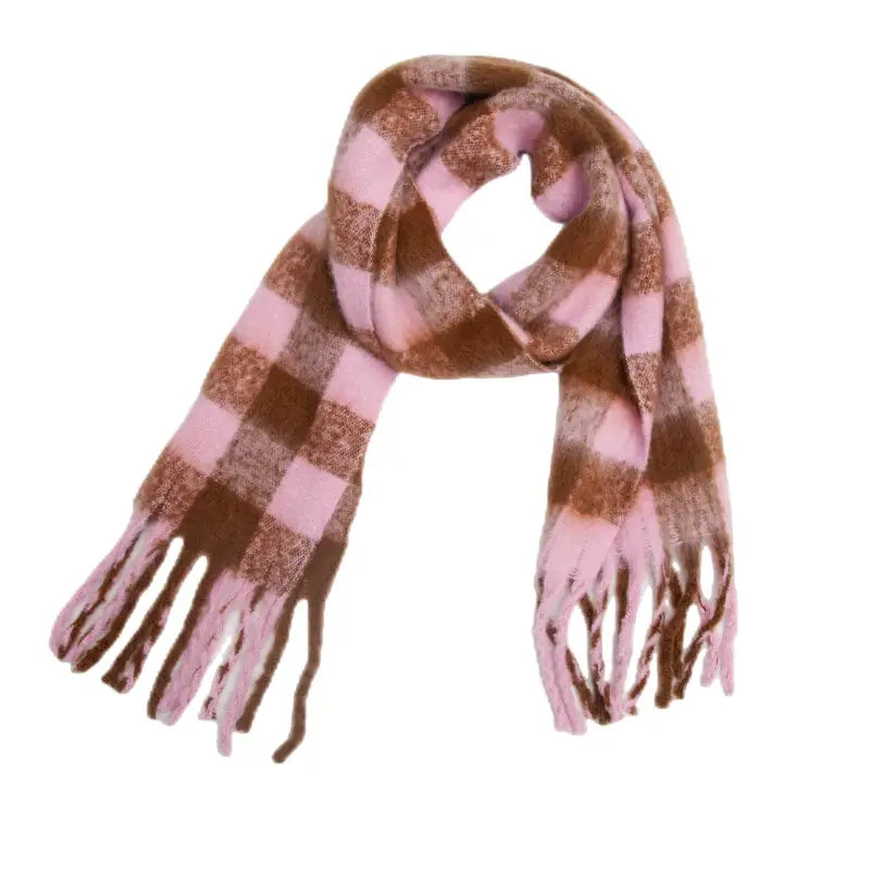 Checkered pink and brown fringed ends on a white wool scarf with colorful print