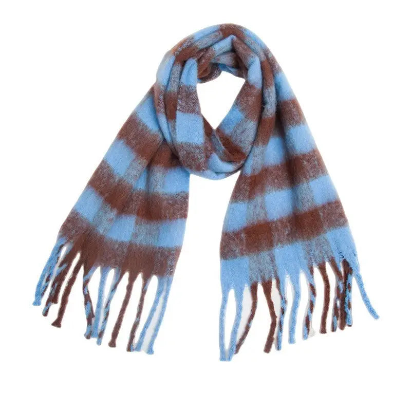 Striped blue and brown scarf with fringed ends, complementing a white wool scarf design