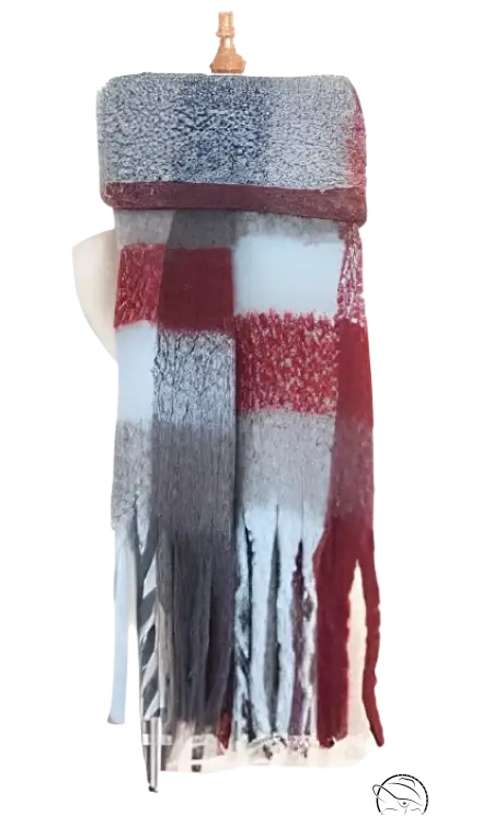 Plaid winter scarf featuring red, gray, and white stripes with fringe, perfect for styling