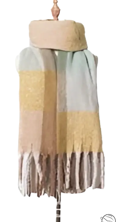 Pastel-colored wool stitching scarf in purplish red with fringe tassels on a dress form