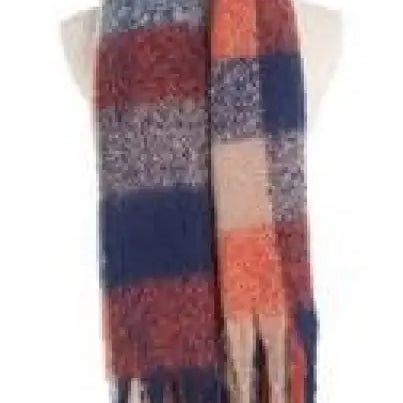 Striped winter scarf with fringe in navy blue, coral pink, and cream colors, showcasing purplish red