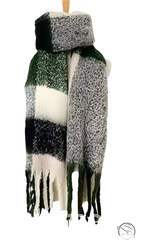 Plaid winter scarf with fringe tassels in green, white, and gray colors next to a purplish red wool stitching scarf