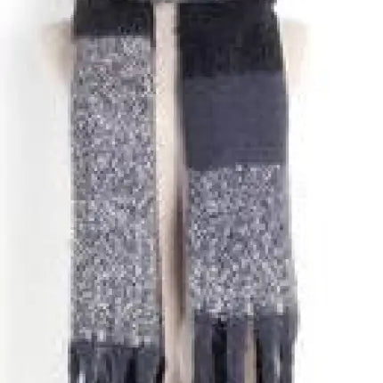 Wool stitching scarf featuring black and gray color blocks with tasseled fringe