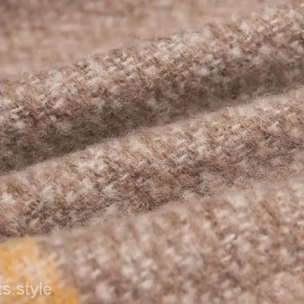 Textured beige woolen fabric with weave, showcasing Woven Wool Stitching Scarf in Rose Plaid Navy